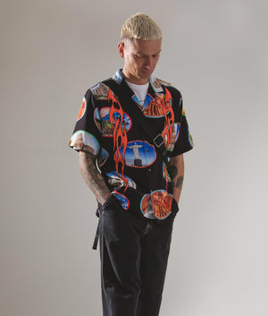 Pleasures Relaxed Fit 7 Wonder Camp Shirt in Black with Full Graphic Colour Print Campaign Shot at EQVVS