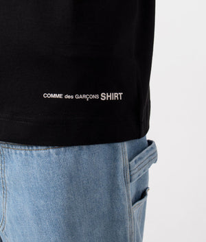 CDG Script Hem Logo T-Shirt in Black. Detail shot at EQVVS.