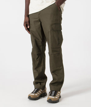 Regular Fit Cargo Pants in Cyprus Rinsed by Carhartt. EQVVS Side Angle Shot.