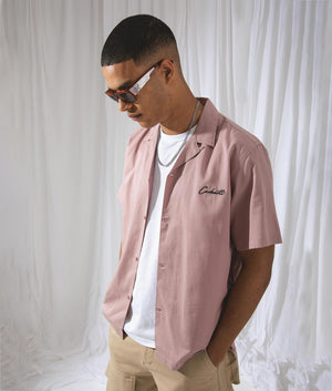 Carhartt WIP Short Sleeve Delray Shirt in Glassy Pink with Black Branding. Campaign Shot at EQVVS