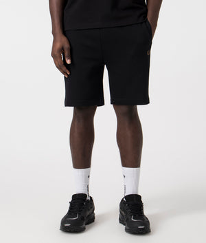 Fred Perry Taped Sweat Short in Black/Warm Stone with side taping detail.  Front angle shot at EQVVS.