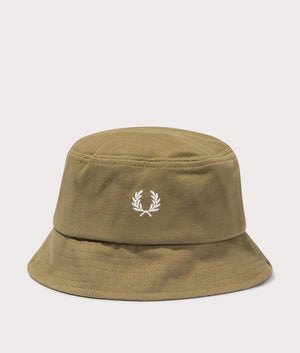 Piqué Bucket Hat in Shaded Stone by Fred Perry. EQVVS Front Angle Shot.