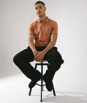 Twin Tipped Polo Shirt in Light Rust/Warm Grey/Night Green by Fred Perry. EQVVS Campaign Shot.
