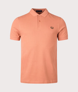 M6000 Polo Shirt in Light Rust/Night Green by Fred Perry. EQVVS Front Angle Shot.