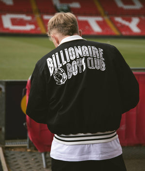 Arch Logo Lightweight Varsity Jacket in Black by Billionaires Club. EQVVS Campaign Shot.