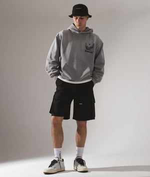 REPRESENT Oversized Cotton Cargo Shorts in Black Campaign Shot at EQVVS