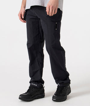 A-COLD-WALL* System Trousers in black side shot at EQVVS