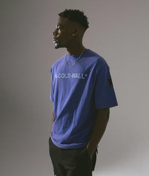 A-COLD-WALL Overdye Logo T-Shirt in volt blue front campaign shot at EQVVS