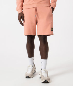 Belstaff Sweat Shorts in Rust Pink. EQVVS Front Angle Shot.