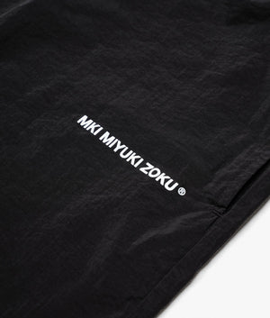 Relaxed Fit Crinkle Nylon Track Shorts in Black by MKI MIYUKI ZOKU. EQVVS Detail Shot.
