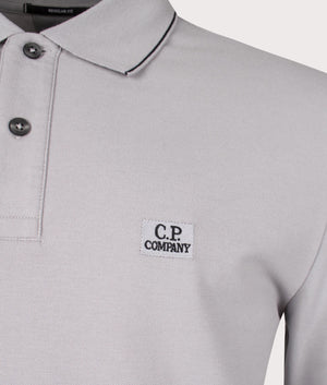 CP Company Stretch Piquet Long Sleeve Polo Shirt in Drizzle Grey Close Up Shot at EQVVS