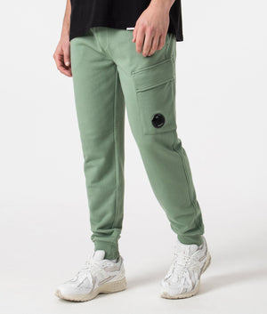 CP Company Diagonal Raised Fleece Cargo Joggers in Green Featuring the CP Company Goggle, 100% Cotton Angle Shot at EQVVS