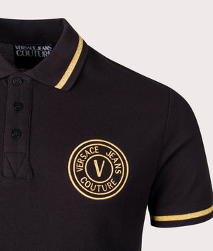 S V Emblem Gold Embroidered Polo Shirt in Black Gold by Versace Jeans Couture. EQVVS Detail Shot.