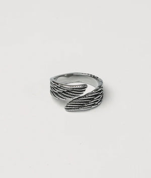 Silver Stainless Steel Wing Ring. shot by EQVVS. Front shot.