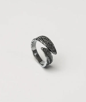 Silver Stainless Steel Wing Ring. shot by EQVVS. Front angled shot.