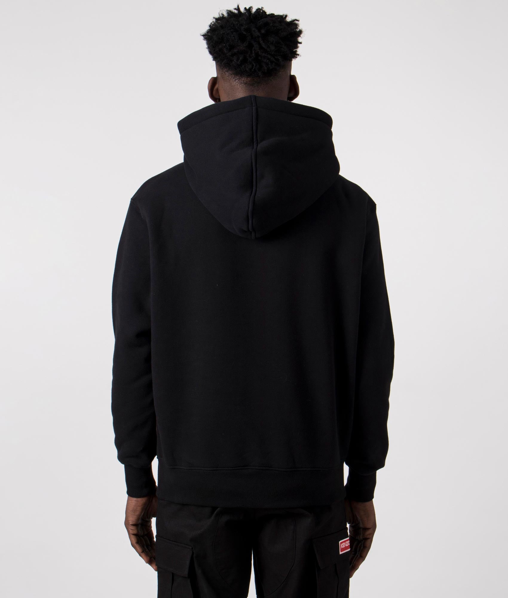 Twitch Hoodie in Black by Pleasures. EQVVS Back Angle Shot.