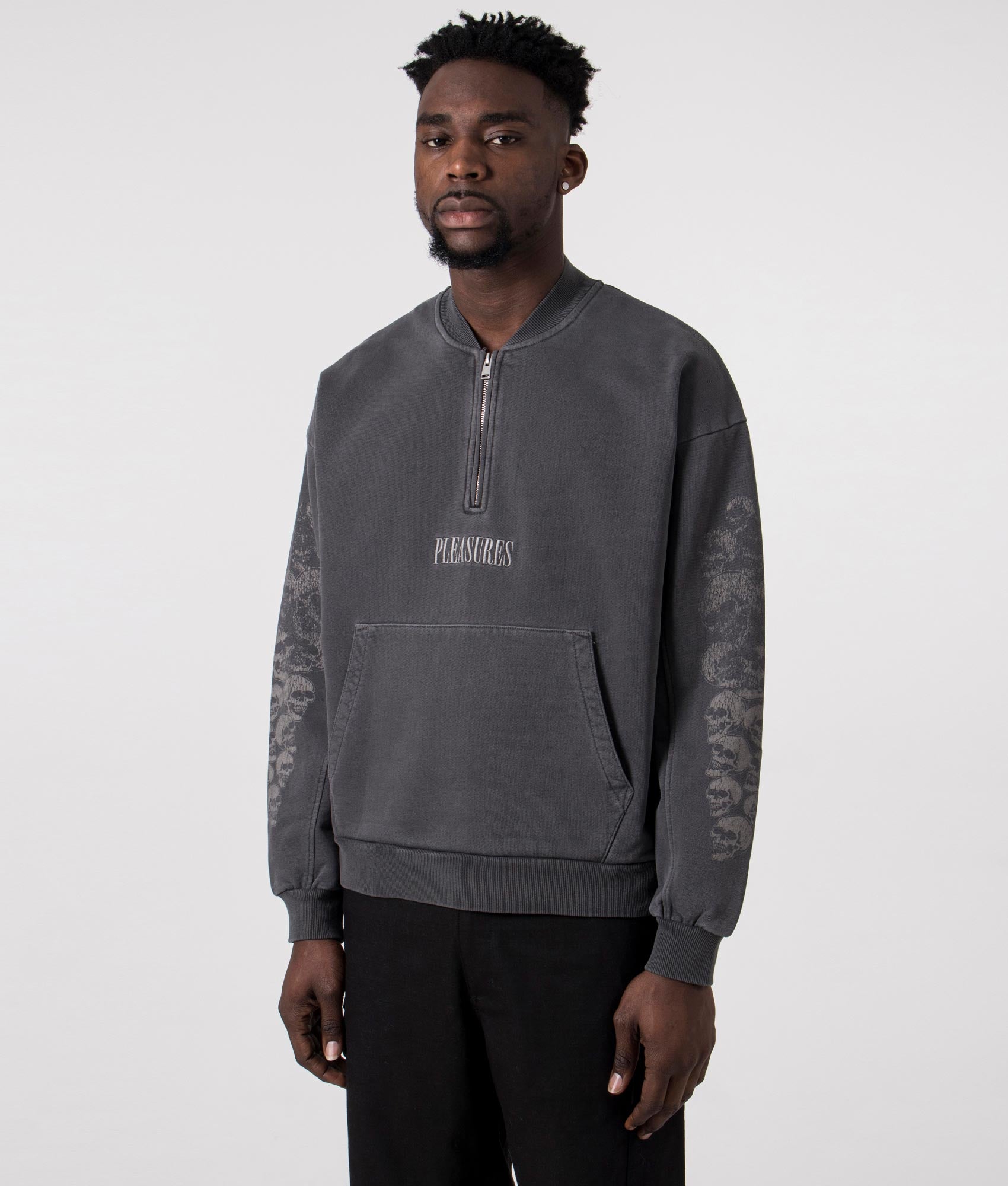 Skull Spiral Quarter Zip in Black by Pleasures. EQVVS Side Angle shot.
