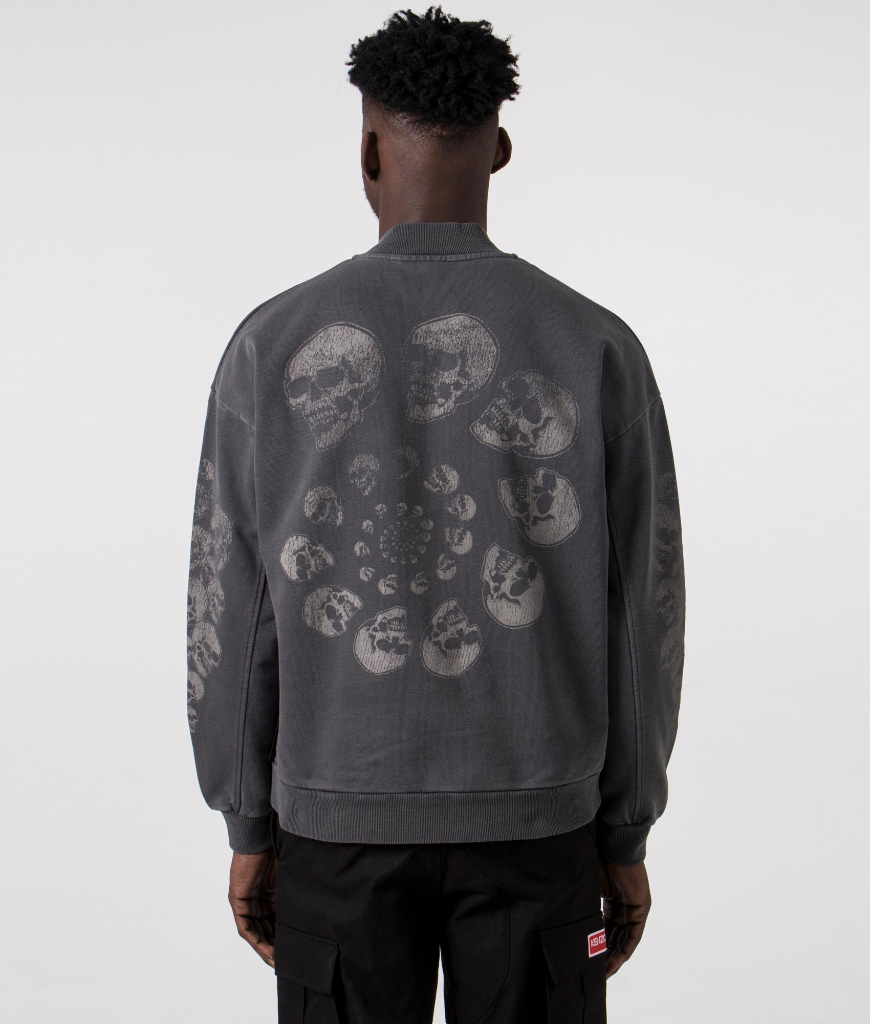 Skull Spiral Quarter Zip in Black by Pleasures. EQVVS Back Detail shot.