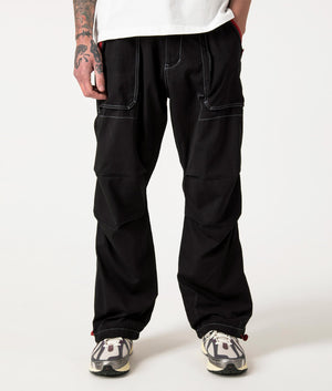 Public Utility Pants in Black by Pleasures. EQVVS Front Angle Shot.