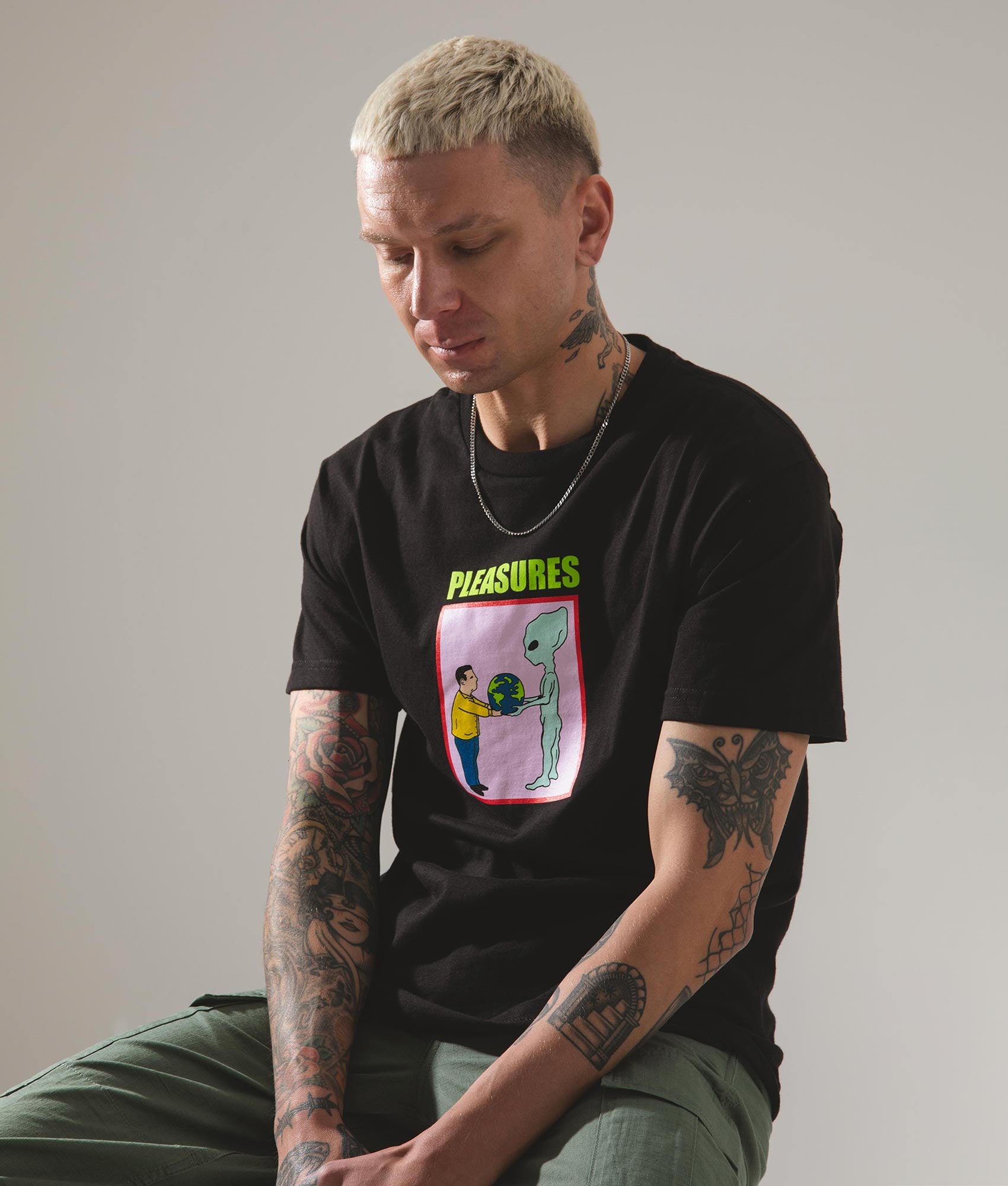 Gift T-Shirt in Black by Pleasures. EQVVS Campaign Shot.