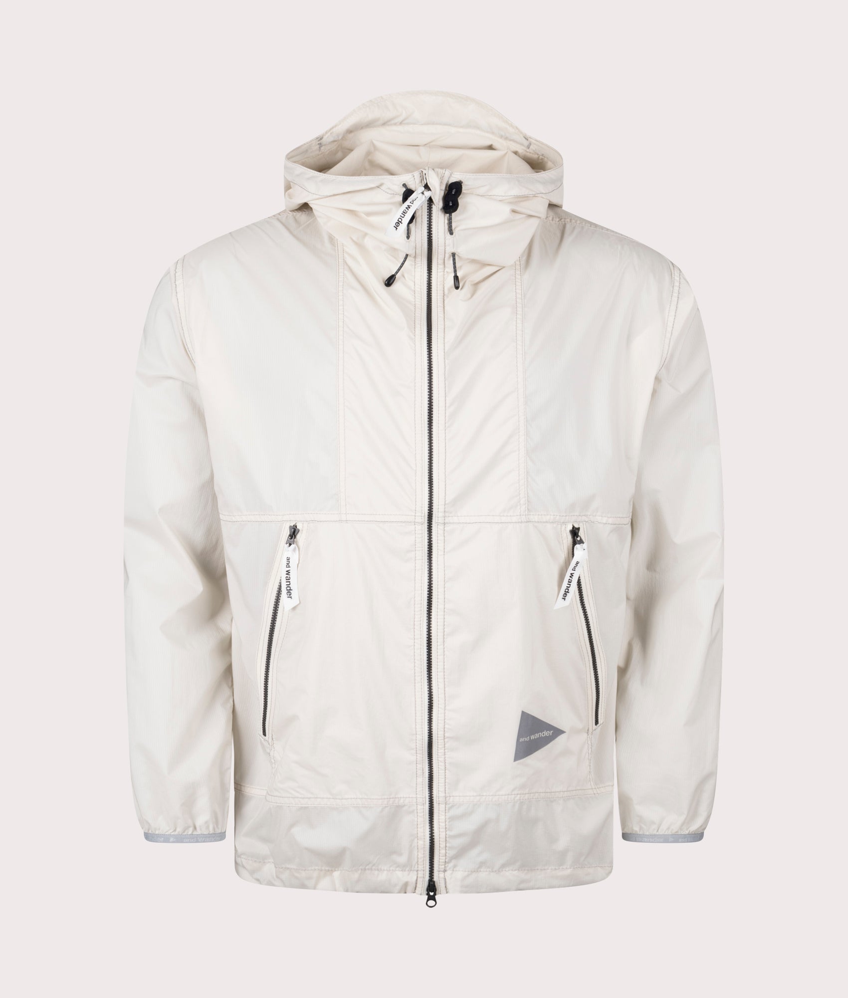 and wander Pertex Wind Jacket in Off White at EQVVS. Front Shot.