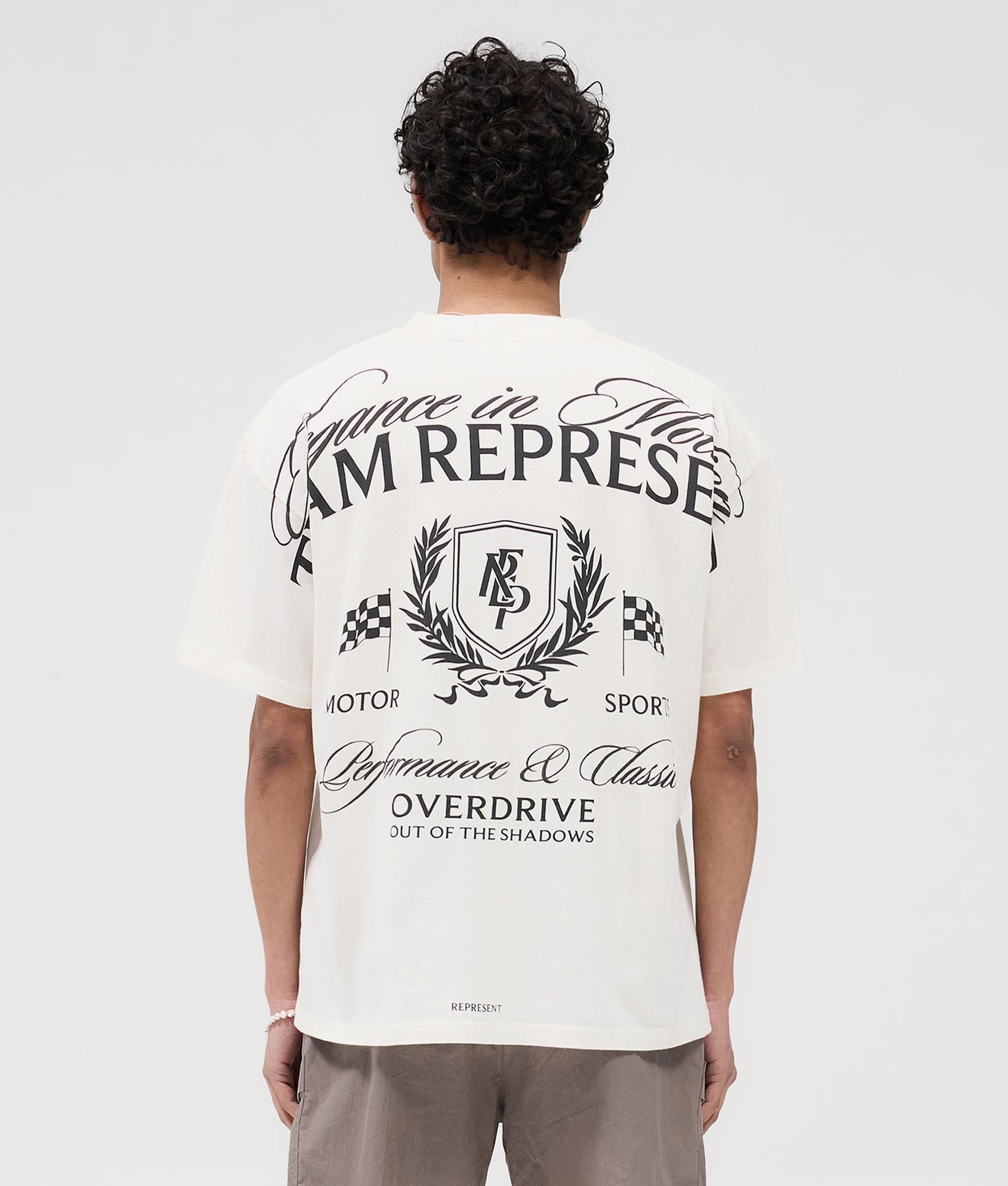Represent Crest T-Shirt in Flat White at EQvVS. Back Model Shot
