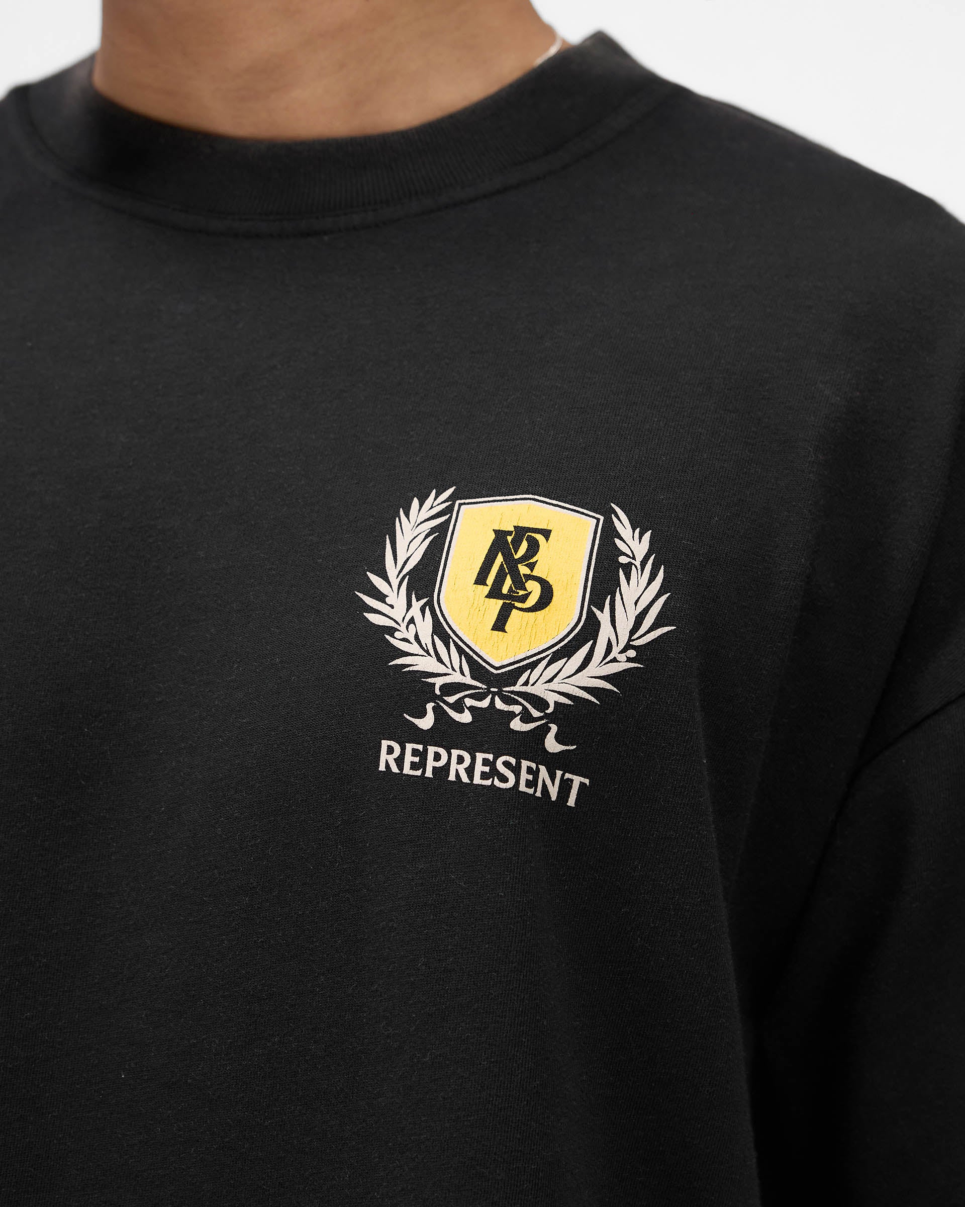 Represent Crest T-Shirt in Flat White at EQvVS. Front Detail Model Shot