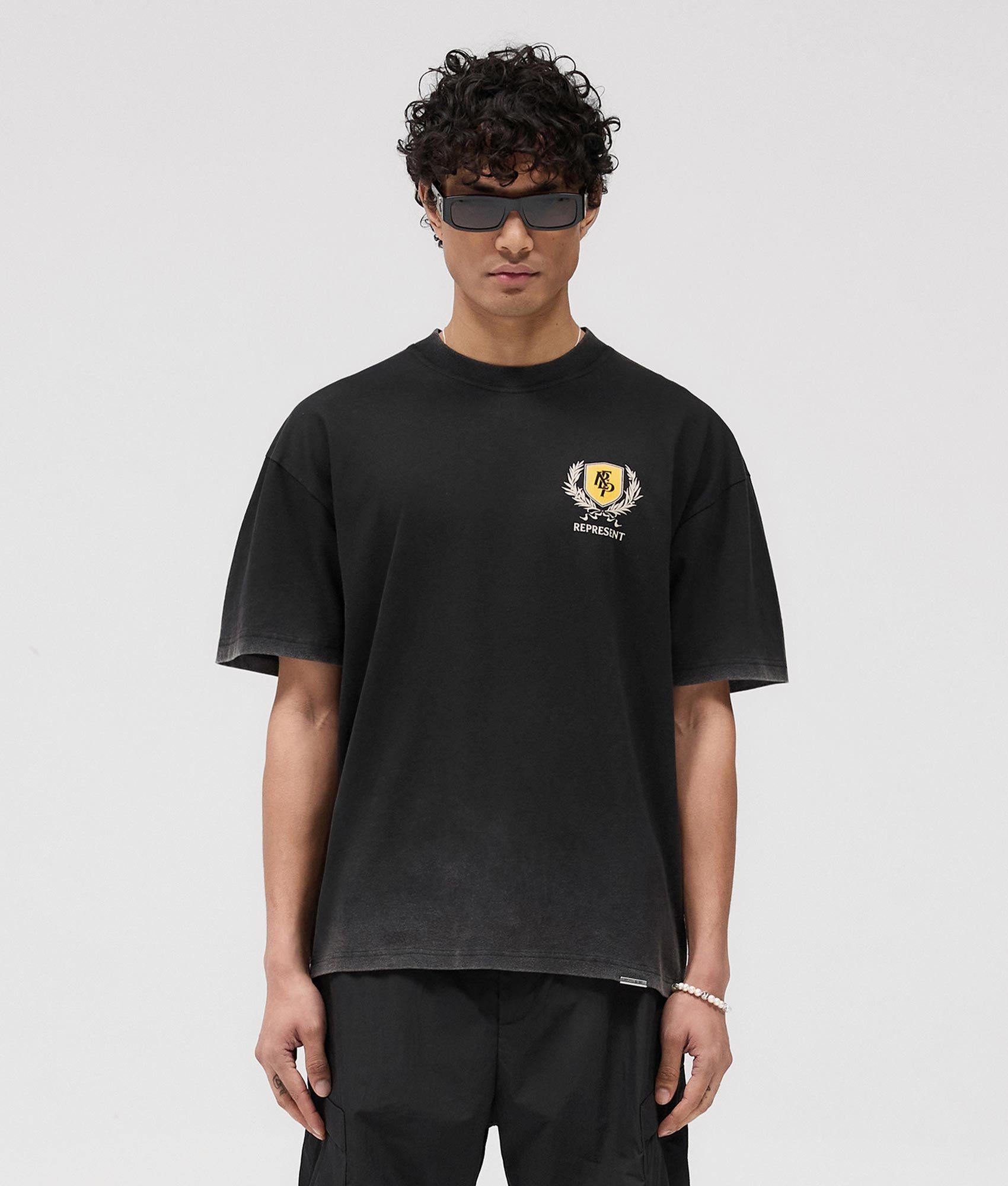 Represent Crest T-Shirt in Flat White at EQvVS. Front Model Shot