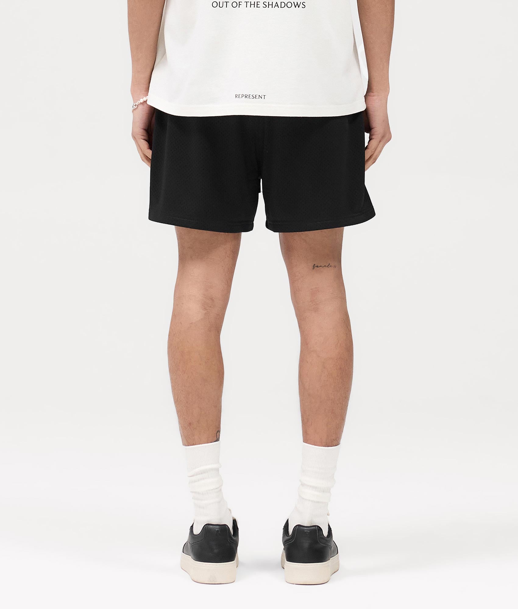 Represent Represent Mesh Shorts in Black at EQVVS. Back Model shot.