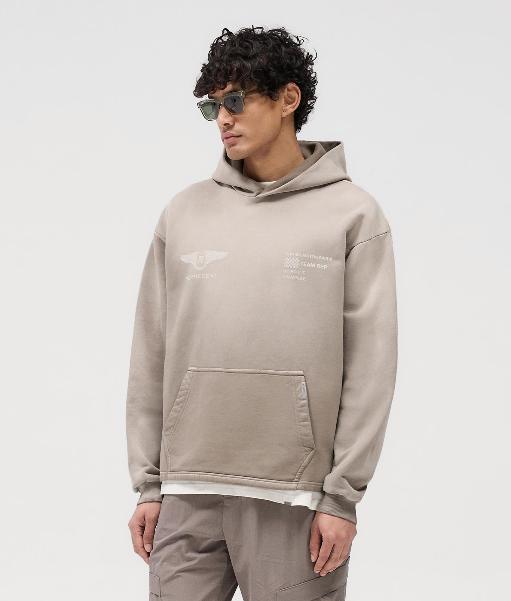 Represent Team Rep Hoodie in Dark Taupe at EQVVS. Model Front Shot