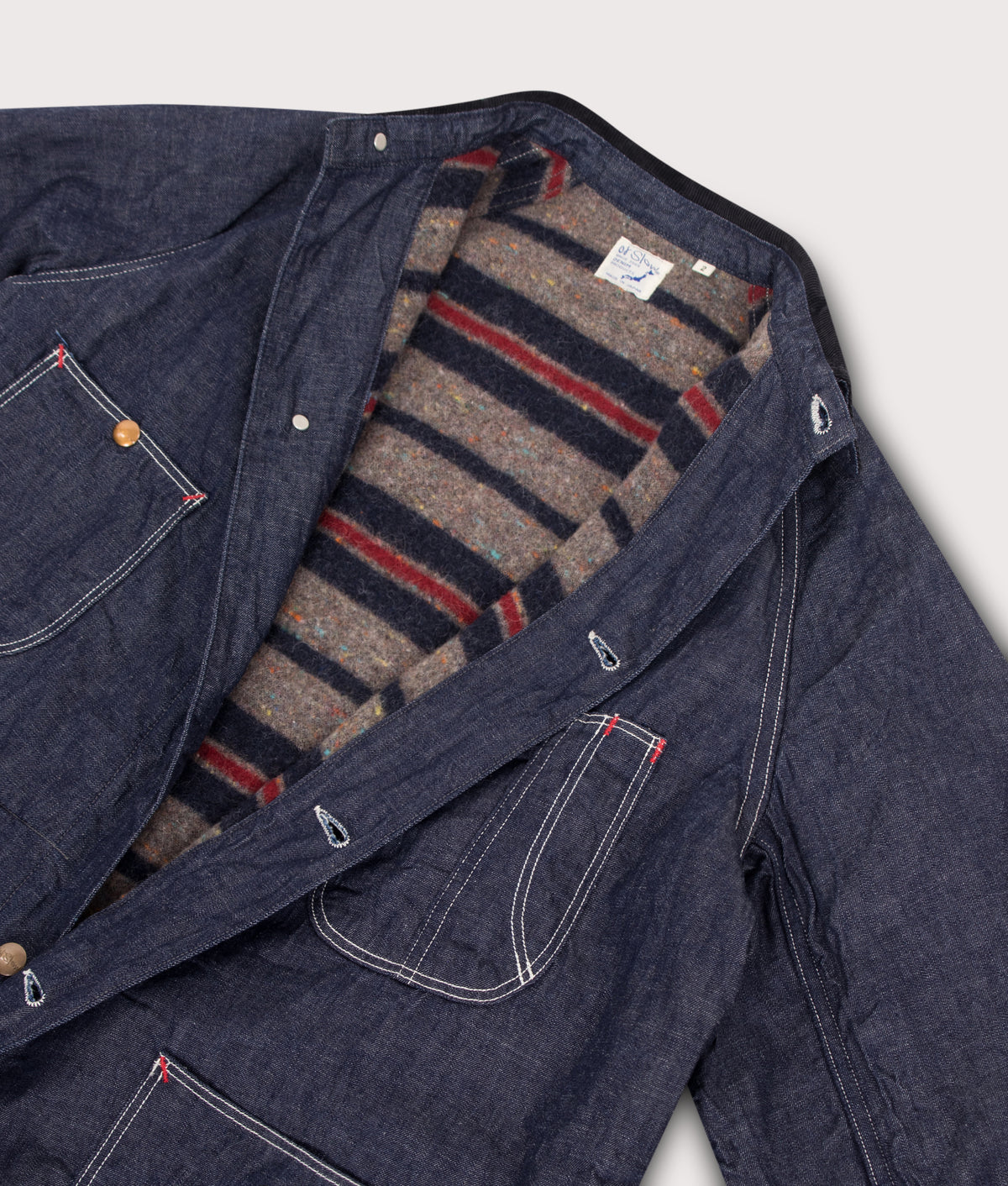 Orslow Relaxed Fit Wool Liner Denim Coverall Overshirt in One wash at EQVVS Menswear. Detail shot.