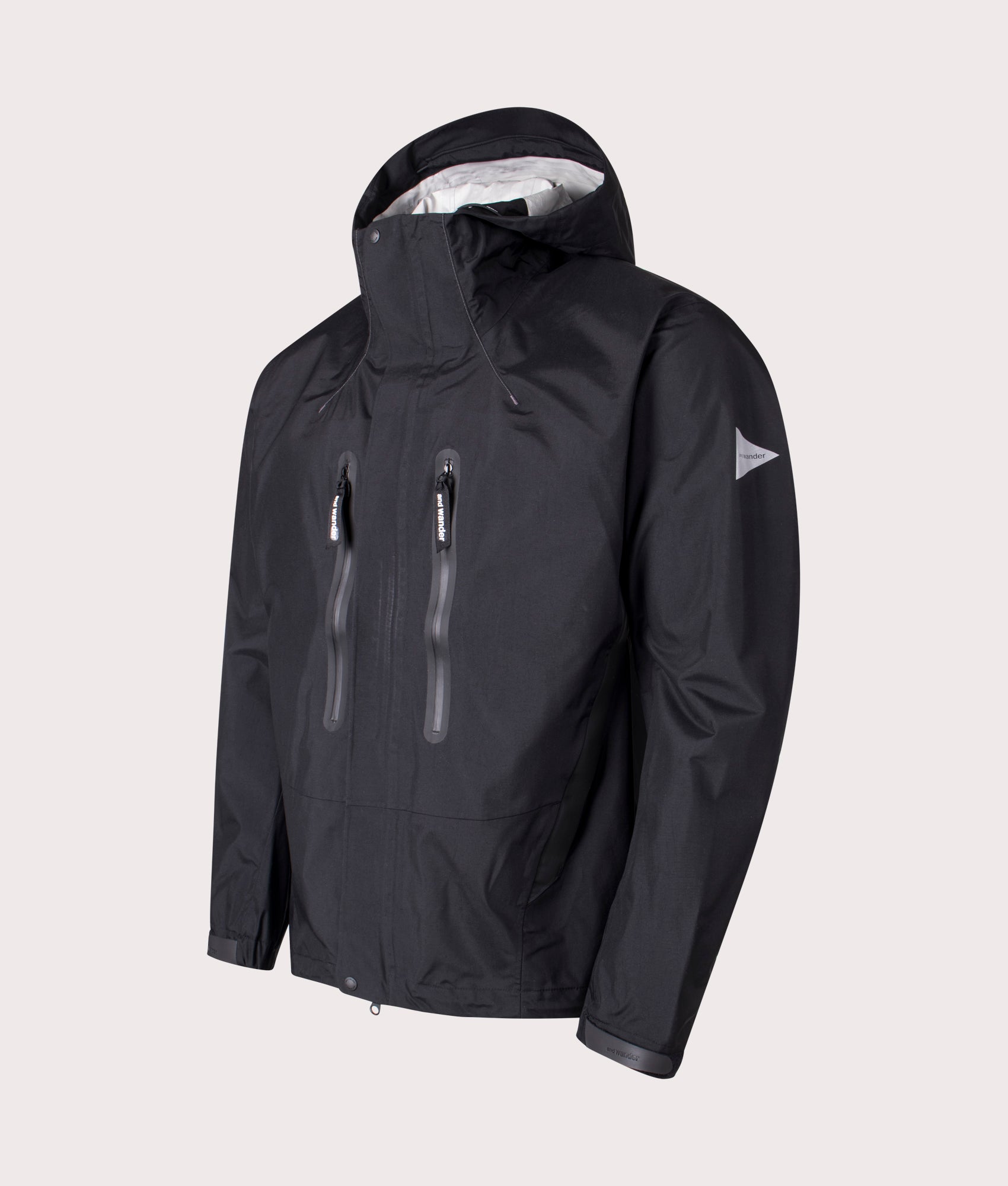 and Wander 2.5L Hiker Rain Jacket in Black. Shot at EQVVS. Front angle shot 