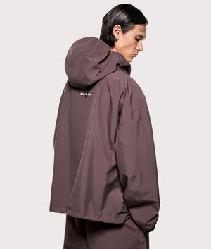 MKI MIYUKI ZOKU Shell Box Jacket in Raisin at EQVVS Menswear. Angled model back shot.