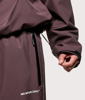 MKI MIYUKI ZOKU Shell Box Jacket in Raisin at EQVVS Menswear. Hem detail shot.