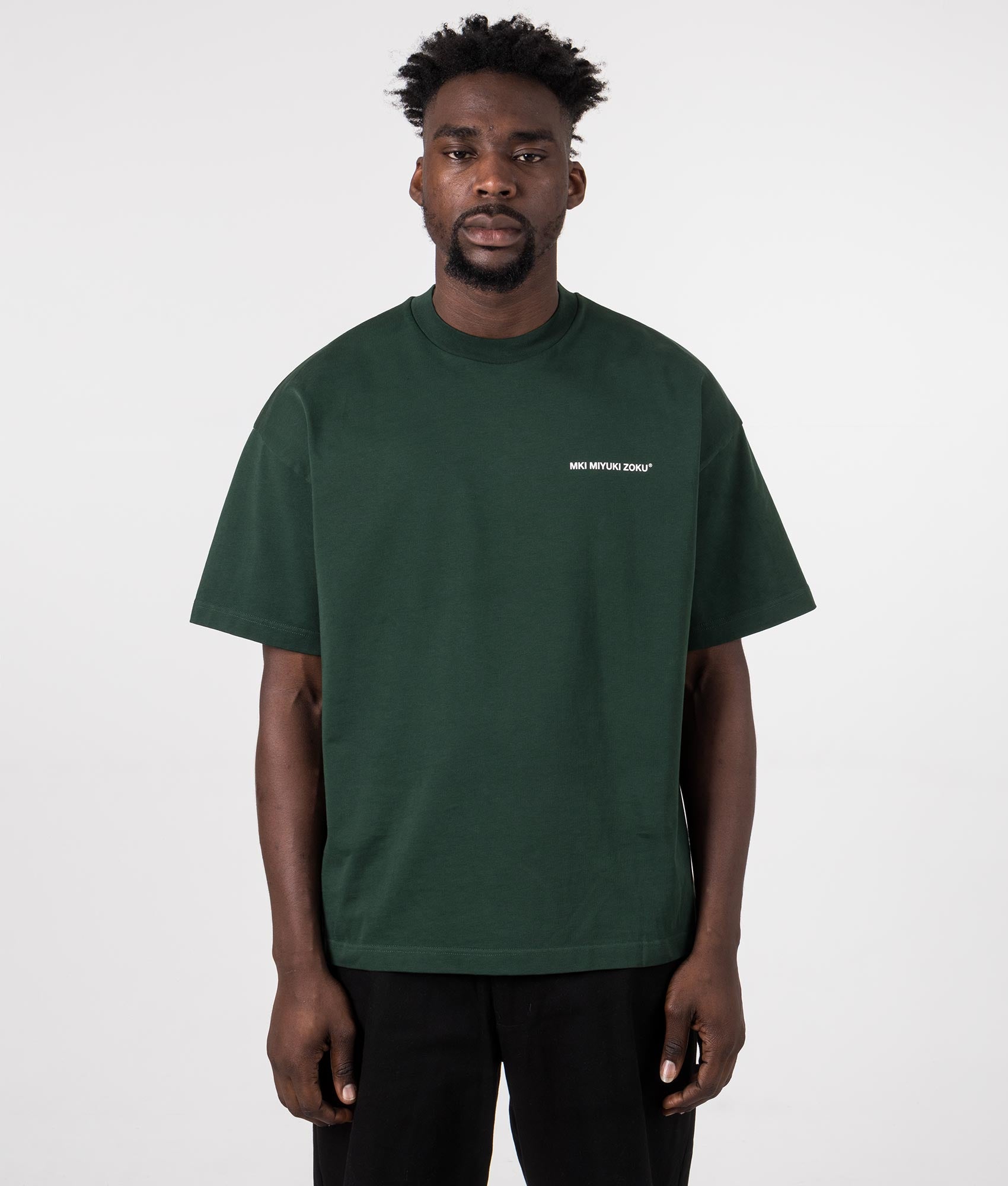 Oversized Uniform T-Shirt in Green from MKI MIYUKI ZOKU. Front Model Shot at EQVVS.