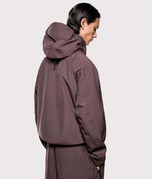 MKI MIYUKI ZOKU V3 Shell Hooded Jacket in Raisin at EQVVS Menswear. Angled model back shot.