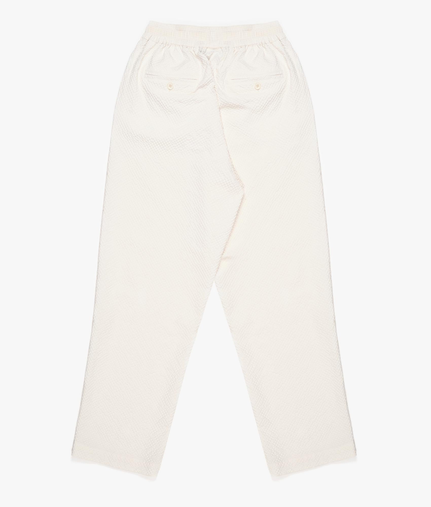Relaxed Fit Seersucker Trousers In Off White by MKI MIYUKI ZOKU. EQVVS Back Angle Shot.