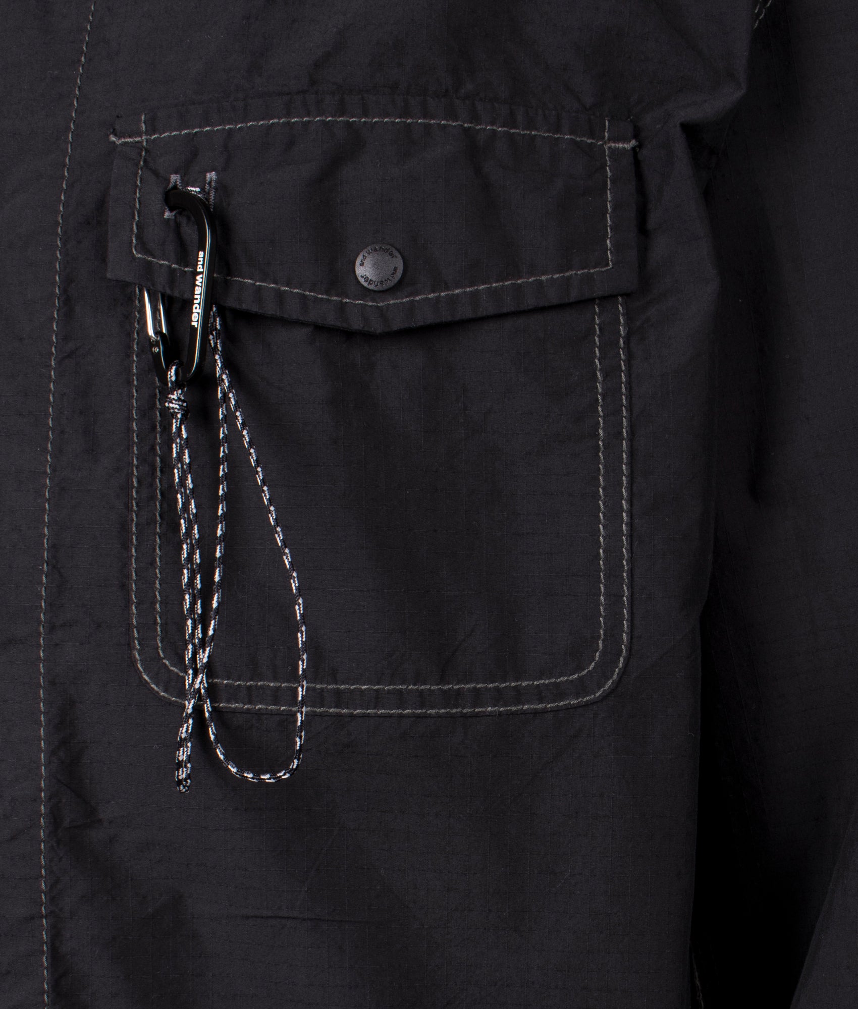 and Wander Cordura Cotton Rip Shirt Jacket in Black. Shot at EQVVS. Front pocket shot 