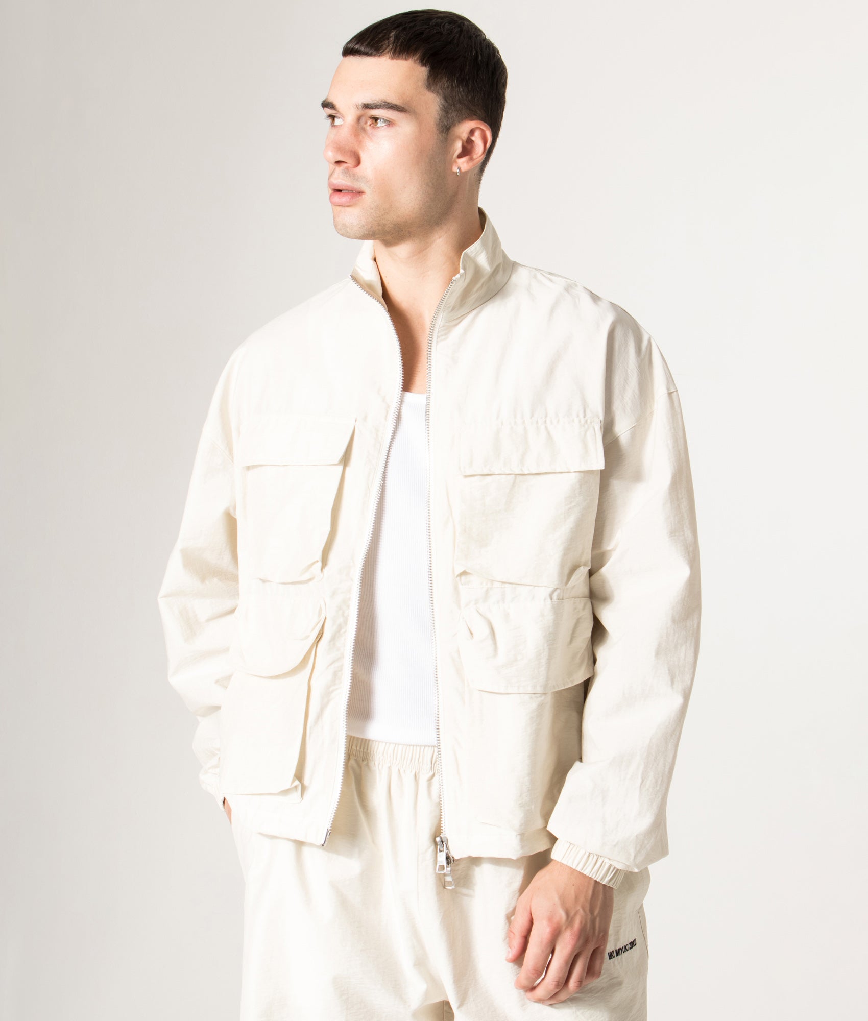 Track Jacket in Bone | MKI MIYUKI ZOKU | Shot at EQVVS | Front model shot