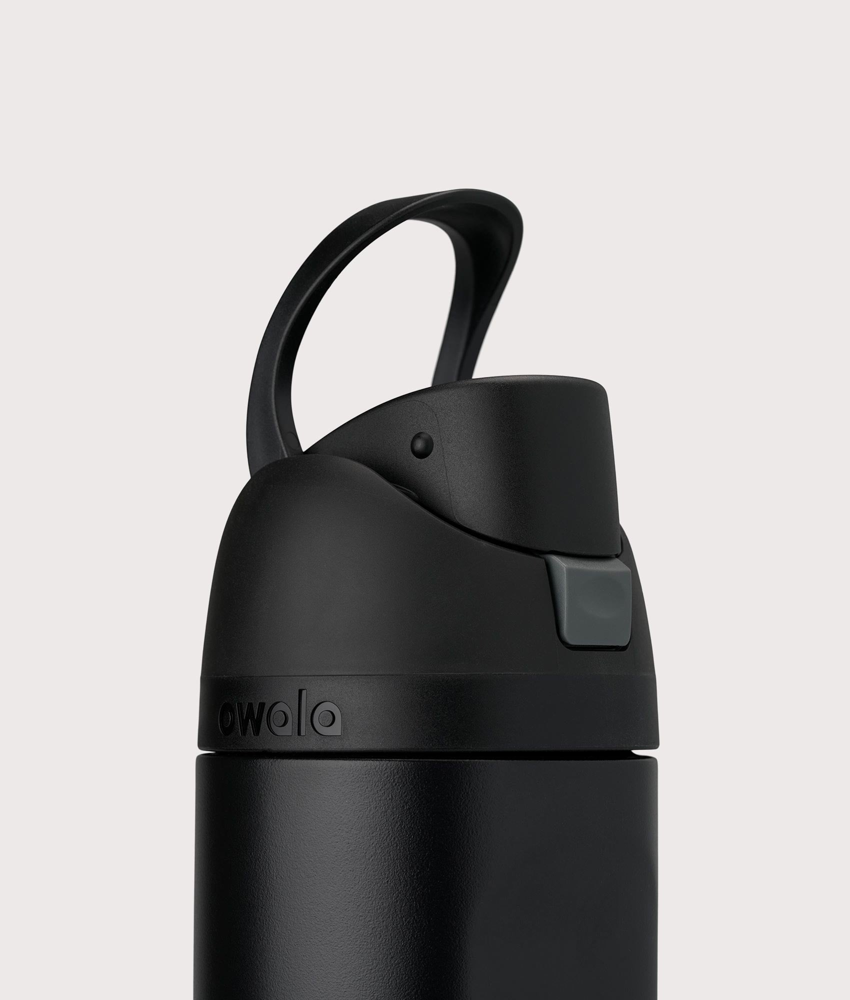 Owala FreeSip® 0.7L / 24-oz Water Bottle in Very Very Dark at EQVVS Menswear. Carry loop shot.