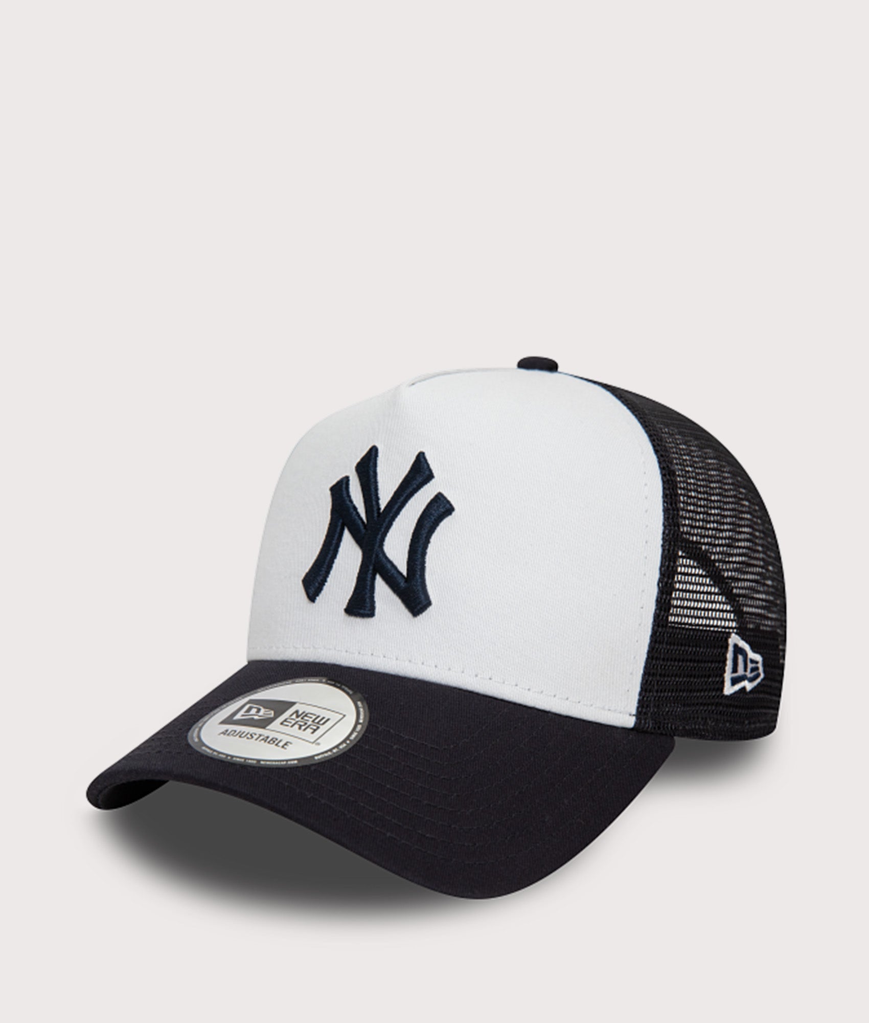 New Era New York Yankees Team Colour Block Trucker Cap in White at EQVVS Menswear. Angled front shot.