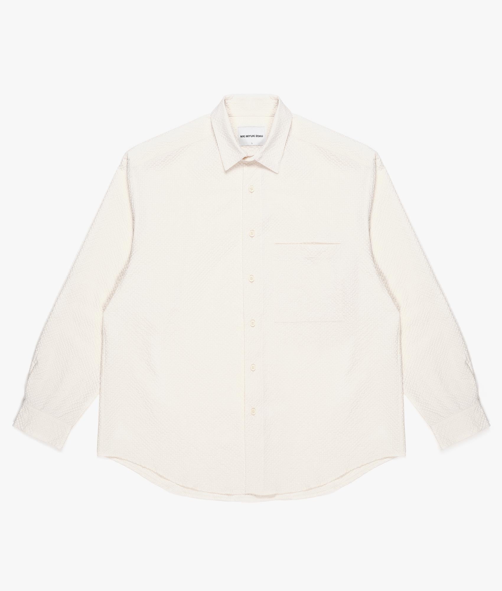 Oversized Seersucker Dress Shirt in White by MKI MIYUKI ZOKU. EQVVS Front Flat Shot.