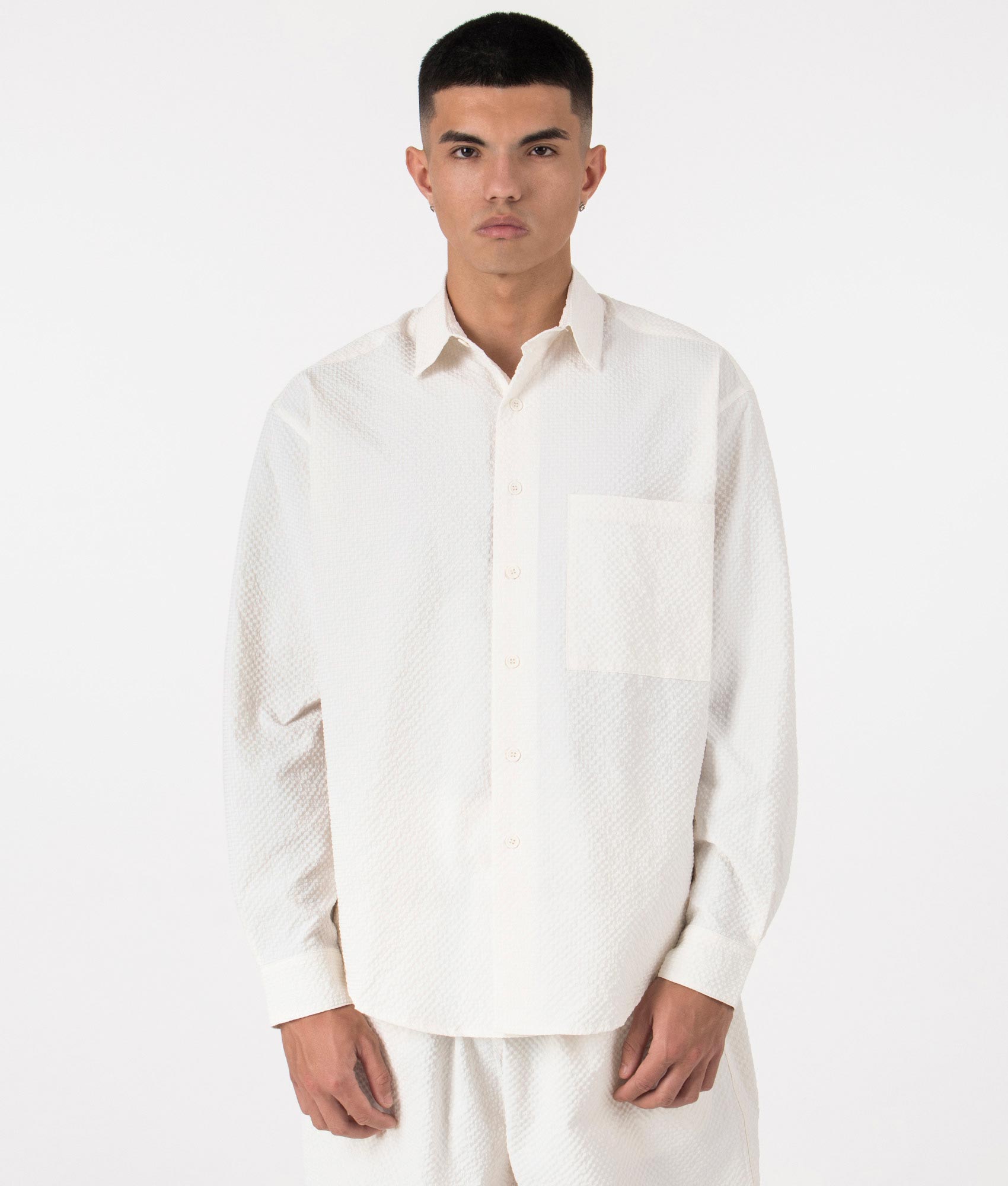 MKI Oversized Seersucker Dress Shirt in Off White. Front angle model shot at EQVVS.