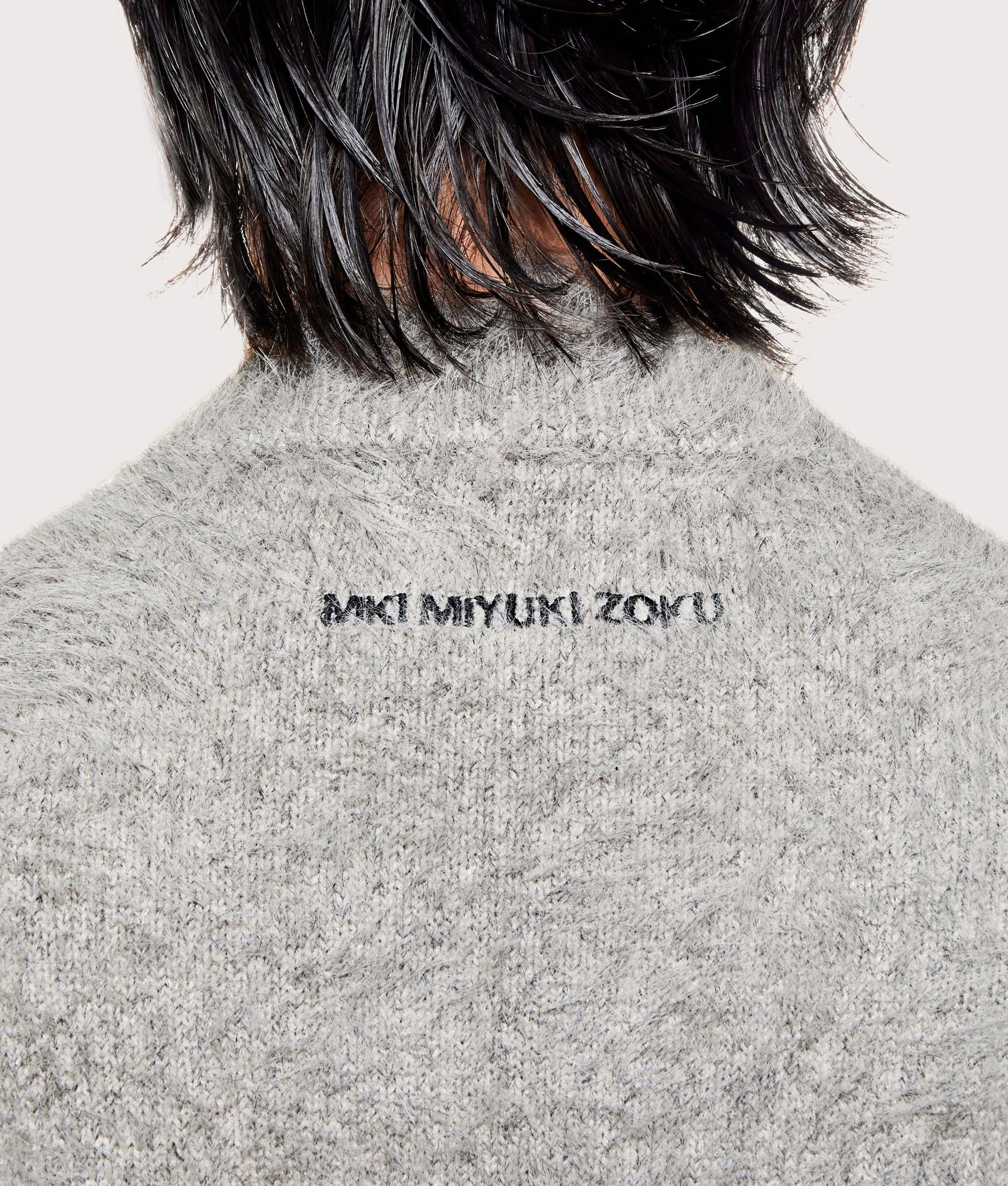 MKI MIYUKI ZOKU Faux Alpaca Knit Track Jacket in  Charcoal Melange at EQVVS Menswear. Detail shot.