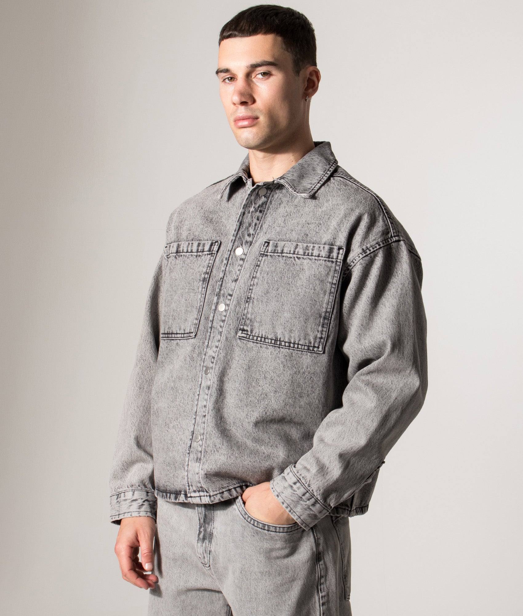 Denim Box Overshirt. Shot by EQVVS. Model side angled shot.