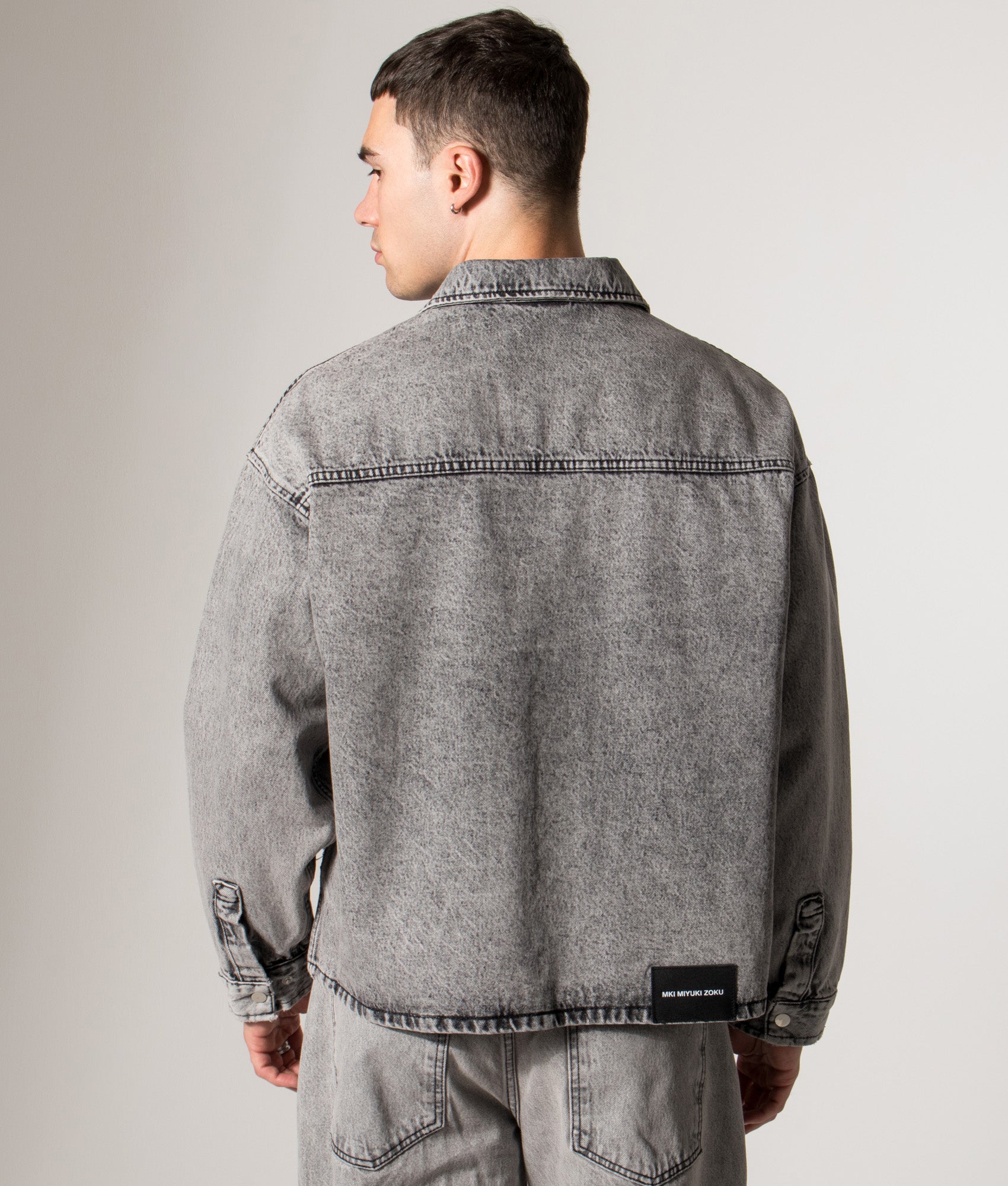 Denim Box Overshirt. Shot by EQVVS. Model back angled shot.
