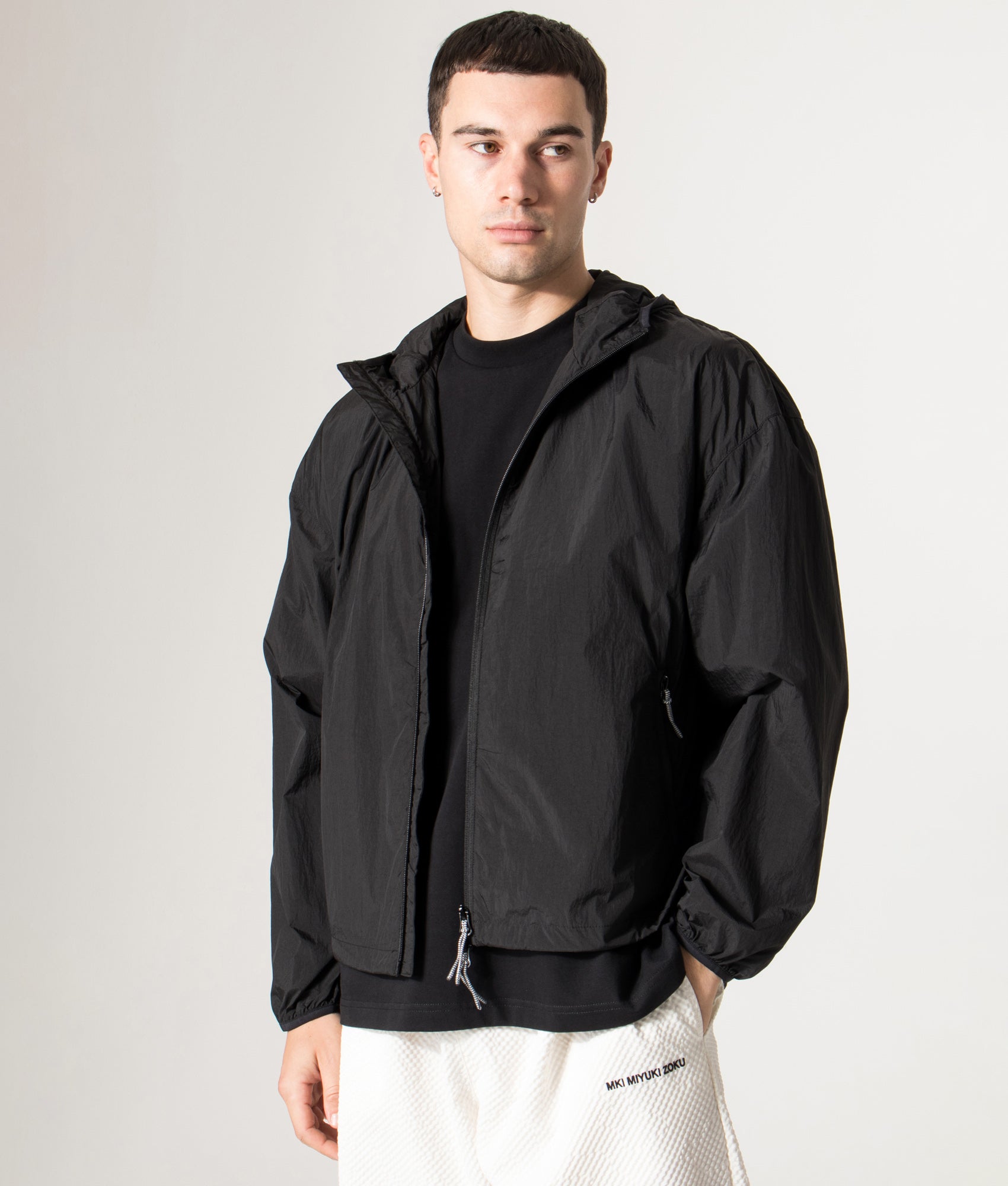 Active Nylon Hooded Jacket in Black | MKI MIYUKI ZOKU | Shot at EQVVS |   Front model shot 