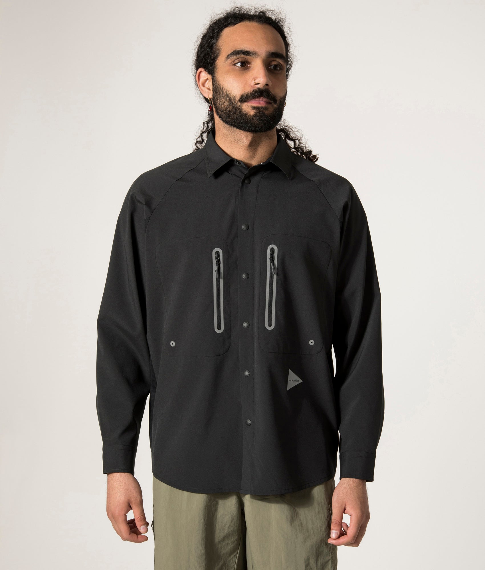 and wander Tech Shirt in Black. Shot at EQVVS. Front Model Shot.