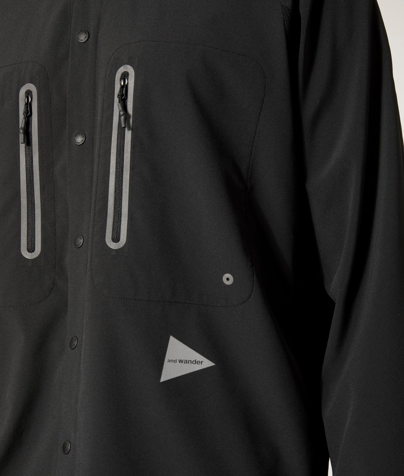 and wander Tech Shirt in Black. Shot at EQVVS. Detail Model Shot.