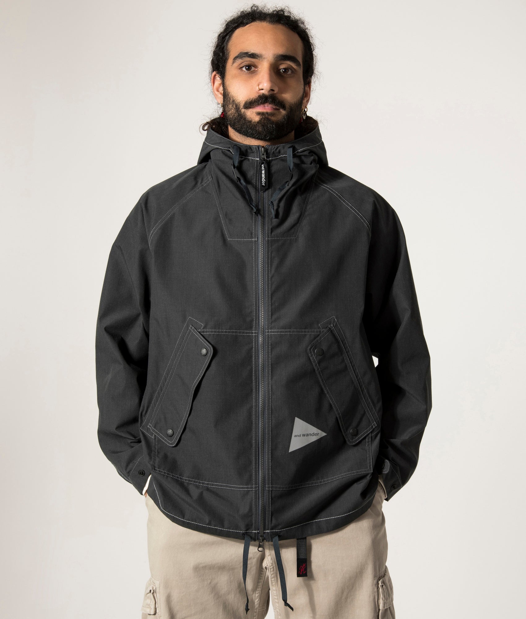 and wander Tough Aramid Hoodie in Charcoal at EQVVS. Front Model Shot.